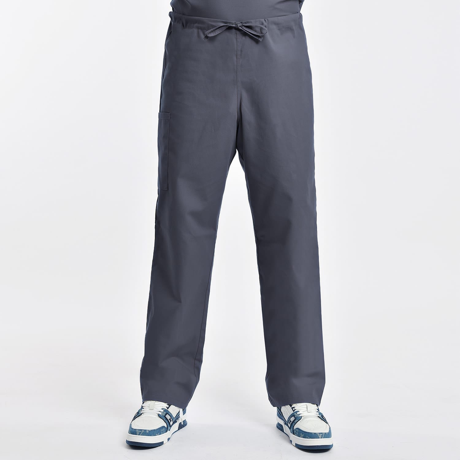 Unisex grey scrub pants with breathable fabric, designed for comfort and durability, featuring an adjustable waist and multiple pockets.