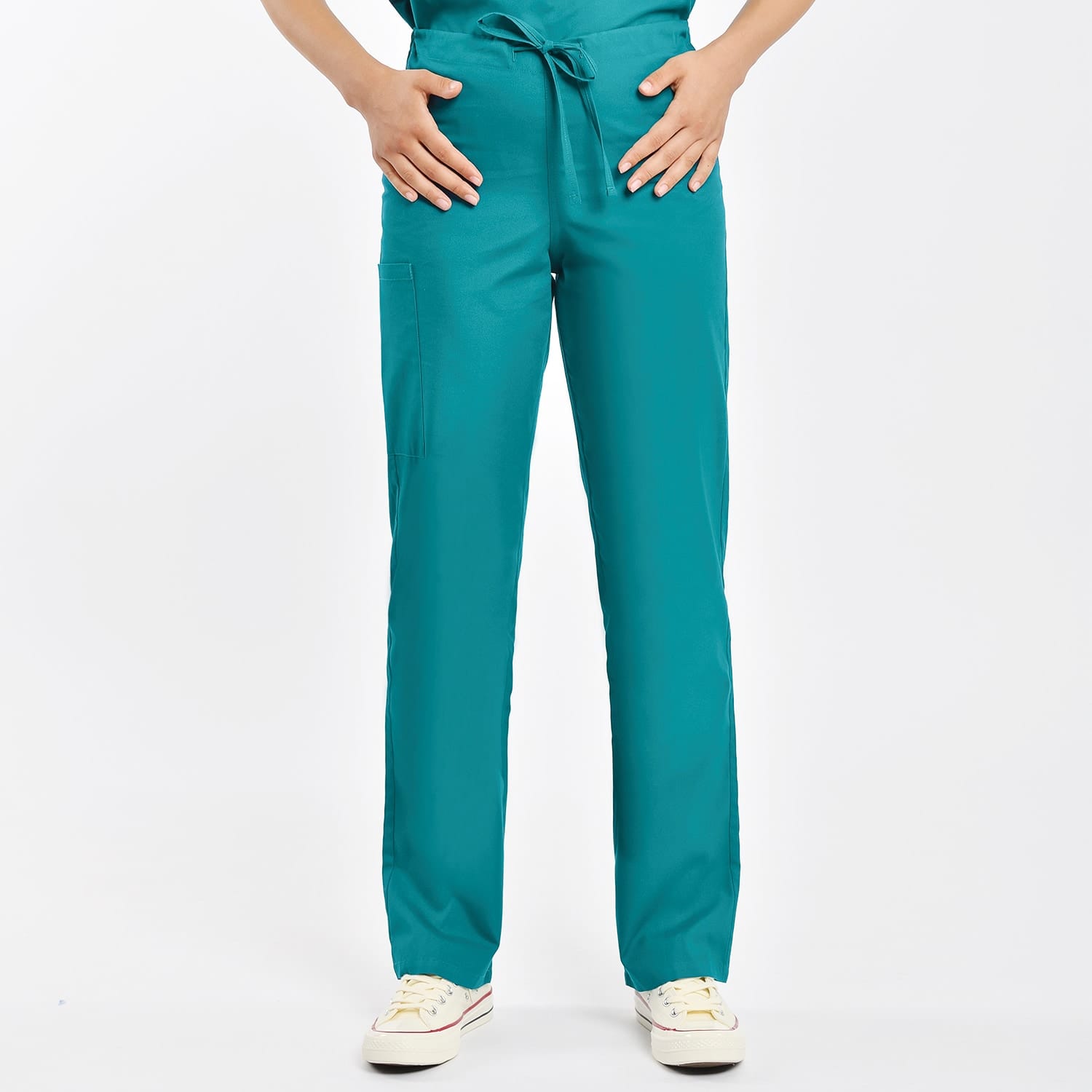 Green unisex scrub pants with elastic waist and functional pockets, perfect for clinical professionals.