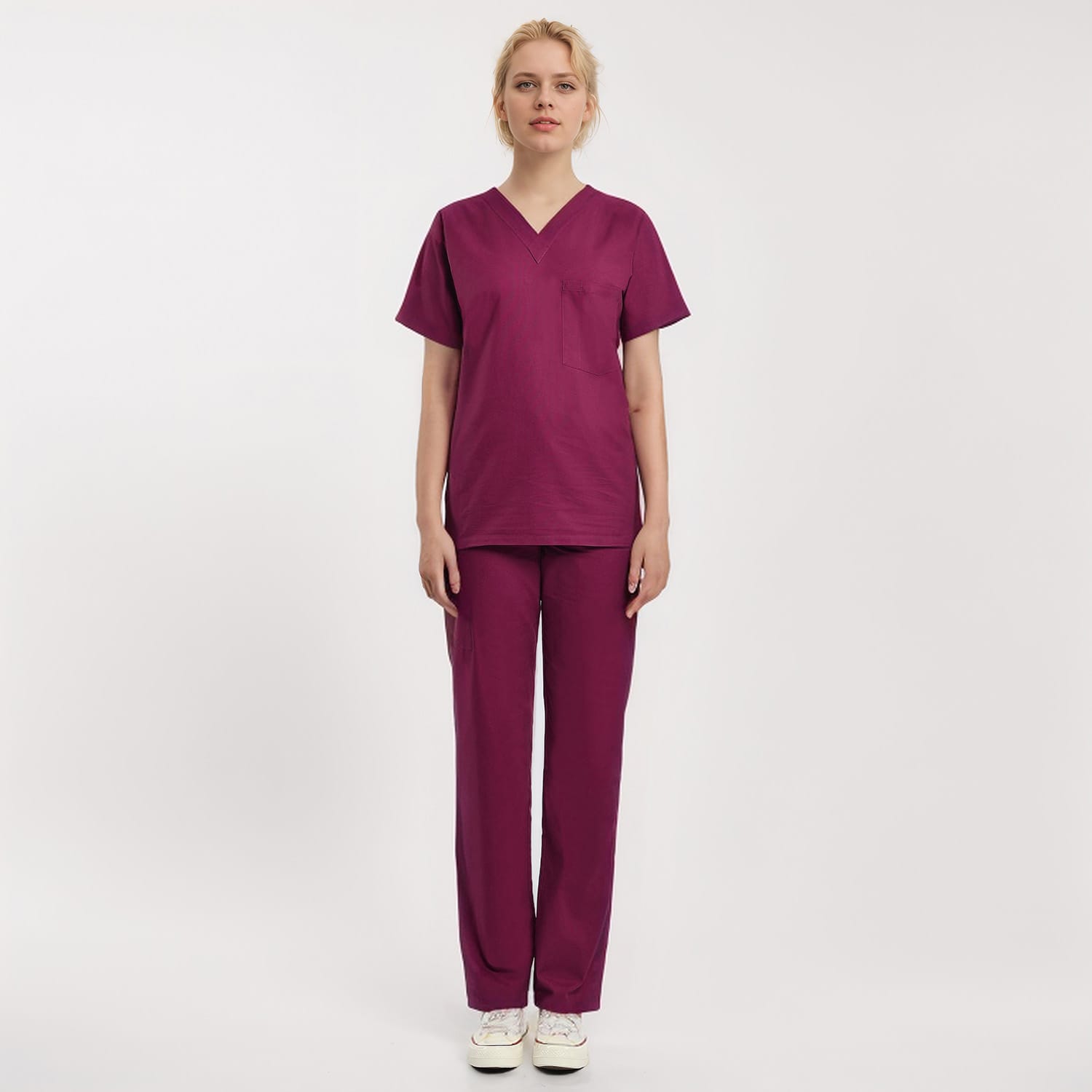 Front view of a model wearing a burgundy Scrub Unisex 1-Pocket V-Neck Scrub Top, designed for healthcare professionals.