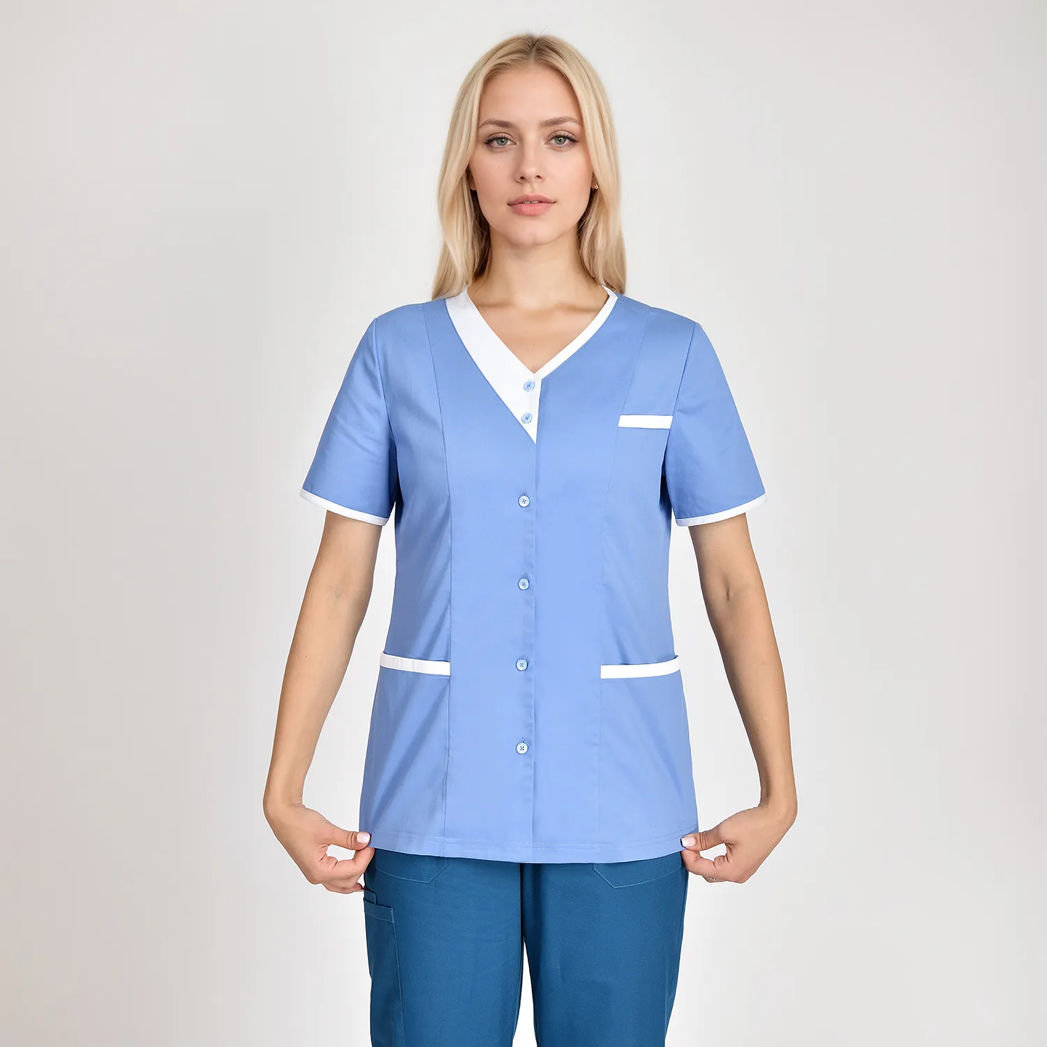 ront view of a women's blue scrub top with a white color block collar and two pockets, designed for comfort and functionality in medical settings.